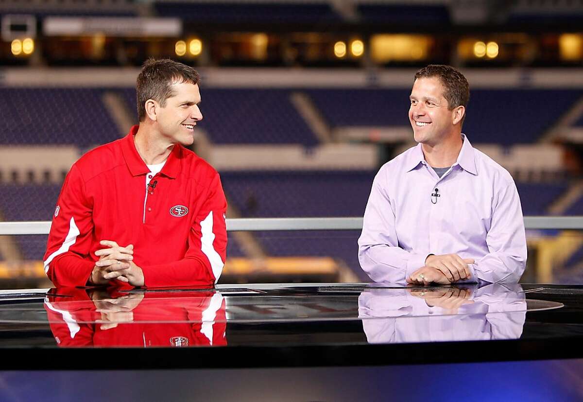 San Francisco head coach Jim Harbaugh and brother Baltimore Ravens head coach John Harbaugh on the NFL Network set during the 2011 NFL Scouting Combine at Lucas Oil Stadium on Feb. 24 in Indianapolis, Ind. (AP Photo/Ben Liebenberg)