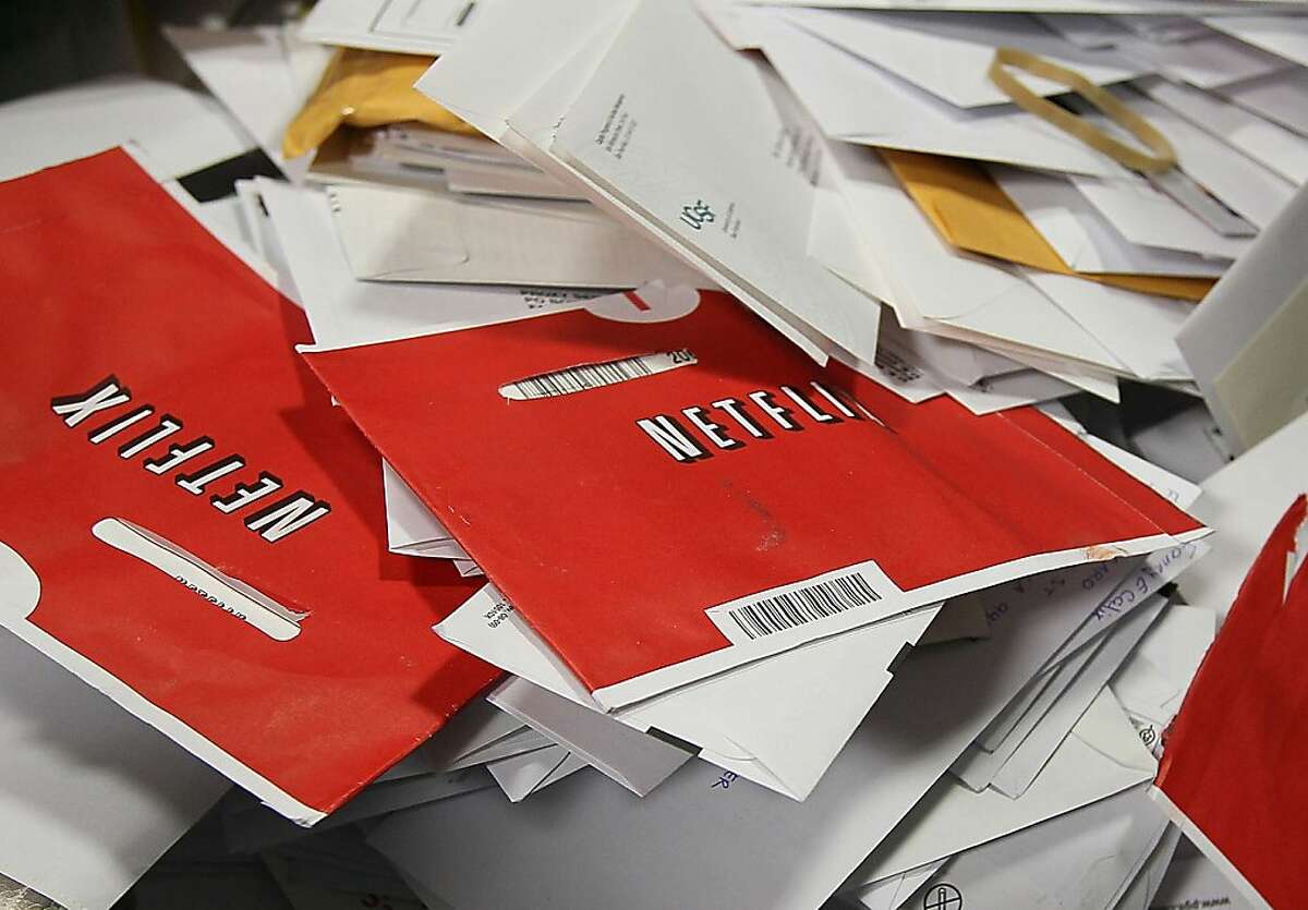 SAN FRANCISCO - FILE: Red Netflix envelopes sit in a bin of mail at the U.S. Post Office sort center March 30, 2010 in San Francisco, California. It was reported that at the closing bell today Netflix will release its third quarter financial performance report in addition to it's announcement that it will be expanding business to Great Britain and Ireland october 24, 2011. (Photo by Justin Sullivan/Getty Images) Ran on: 10-25-2011 The number of Netflix customers with mail subscriptions is dwindling the company may lose millions this quarter.
