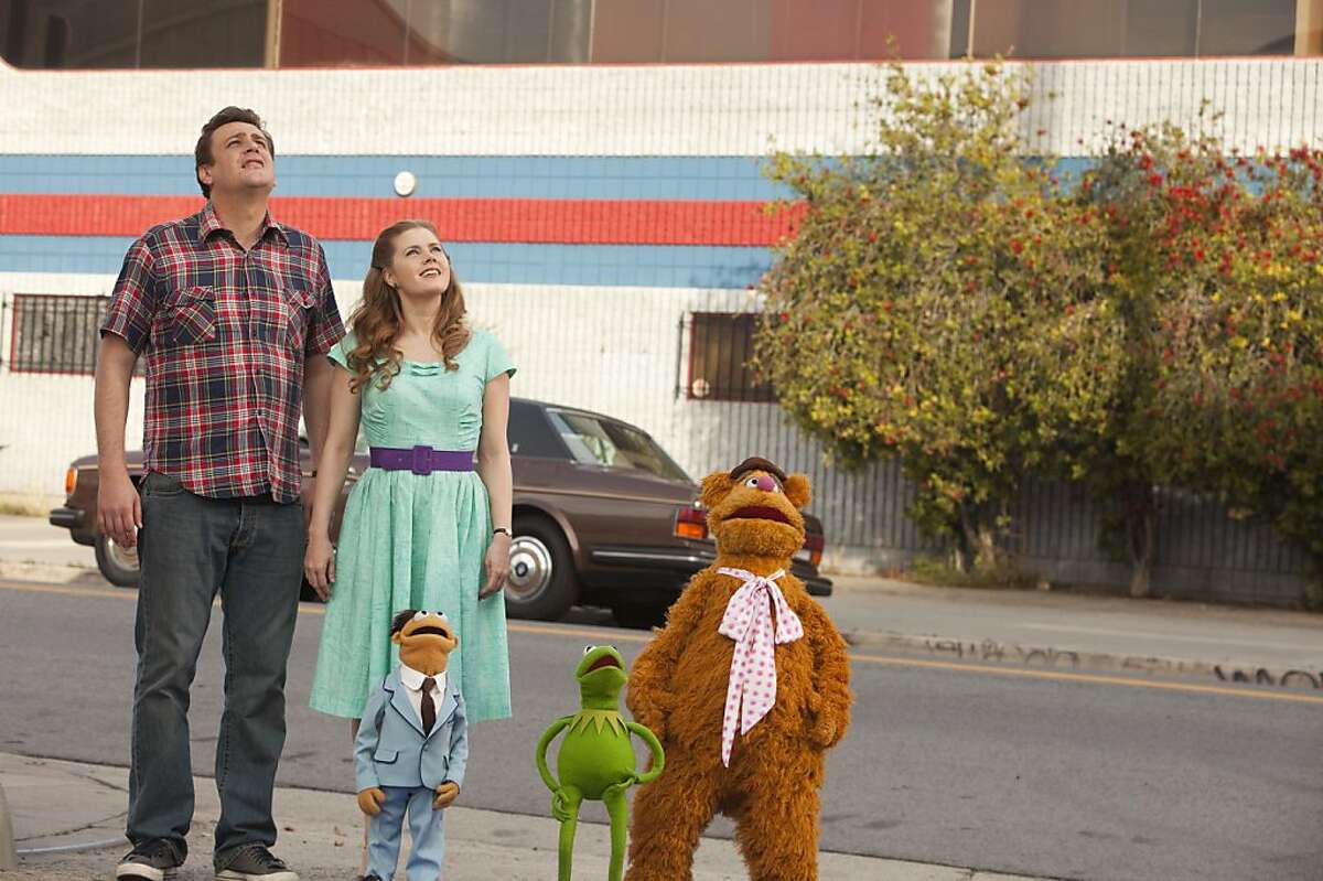 "THE MUPPETS" UP AND AWAY Ð Kermit, Fozzie Bear, are joined by Gary (JASON SEGEL) and Mary (AMY ADAMS) and new Muppet, Walter, as they search for their old friend The Great Gonzo, who is now?‘believe it or not?‘a plumbing magnate. Will their plans go down the drain? Find out in THE MUPPETS (Opening in theatres on November 23rd). Photograph by: Scott Garfield ©Disney Enterprises, Inc. All Rights Reserved.