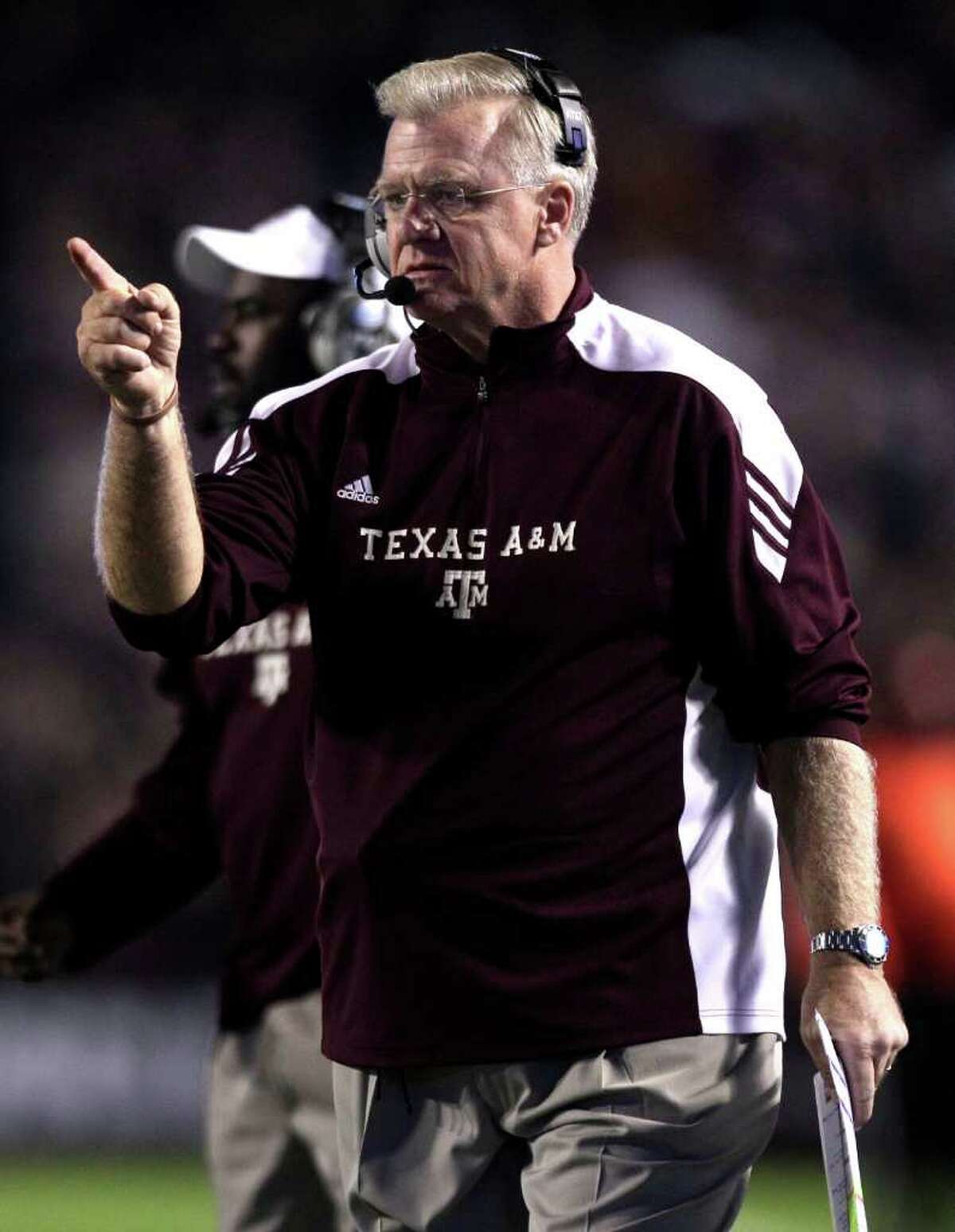 Texas A&M head coach Mike Sherman calls out a play during the first quarter of an NCAA college football game at Kyle Field Thursday, Nov. 24, 2011, in College Station.