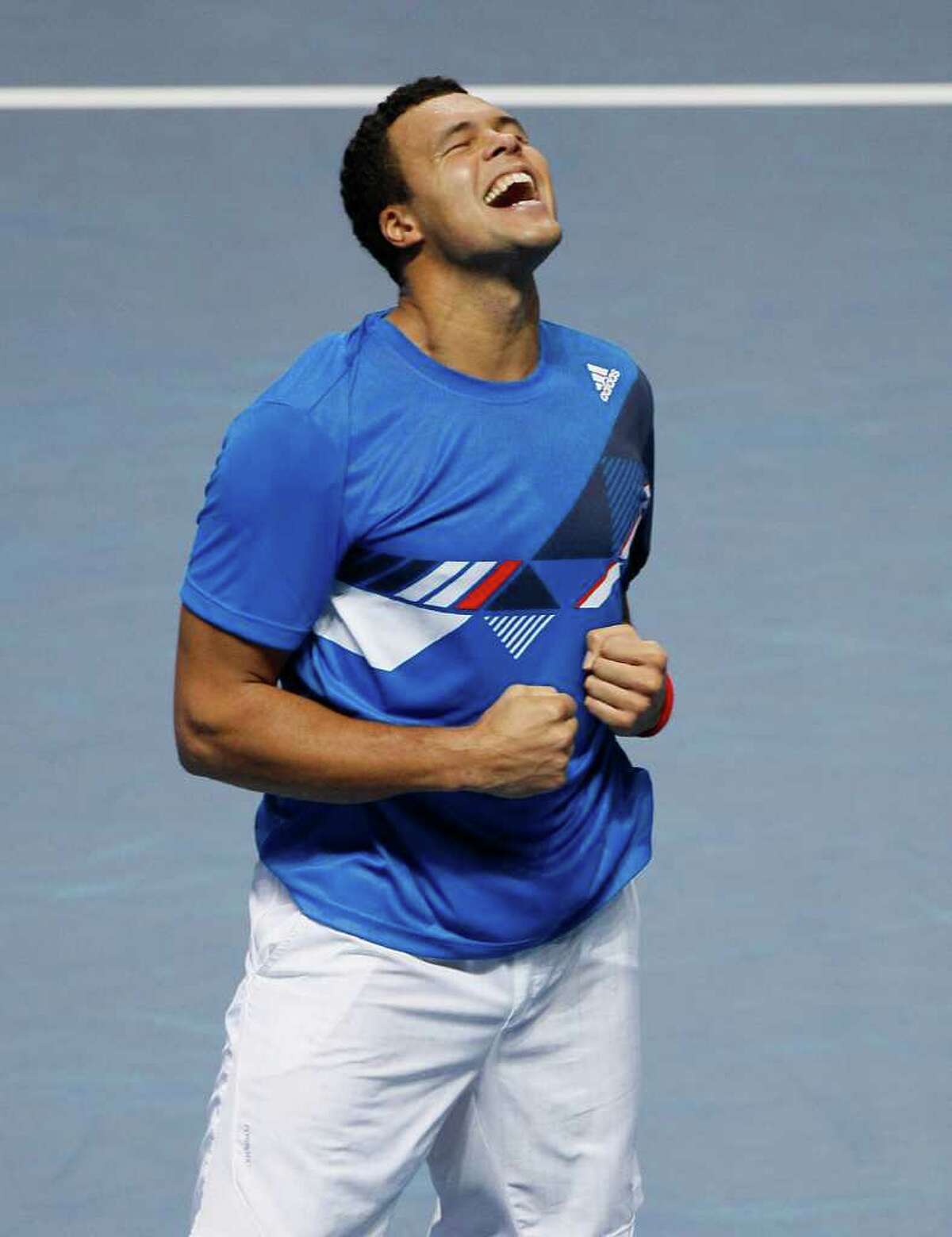 KIRSTY WIGGLESWORTH: ASSOCIATED PRESS BIG WIN: Jo-Wilfried Tsonga savors the moment after upsetting Rafael Nadal at the ATP World Tour Finals in London on Thursday.