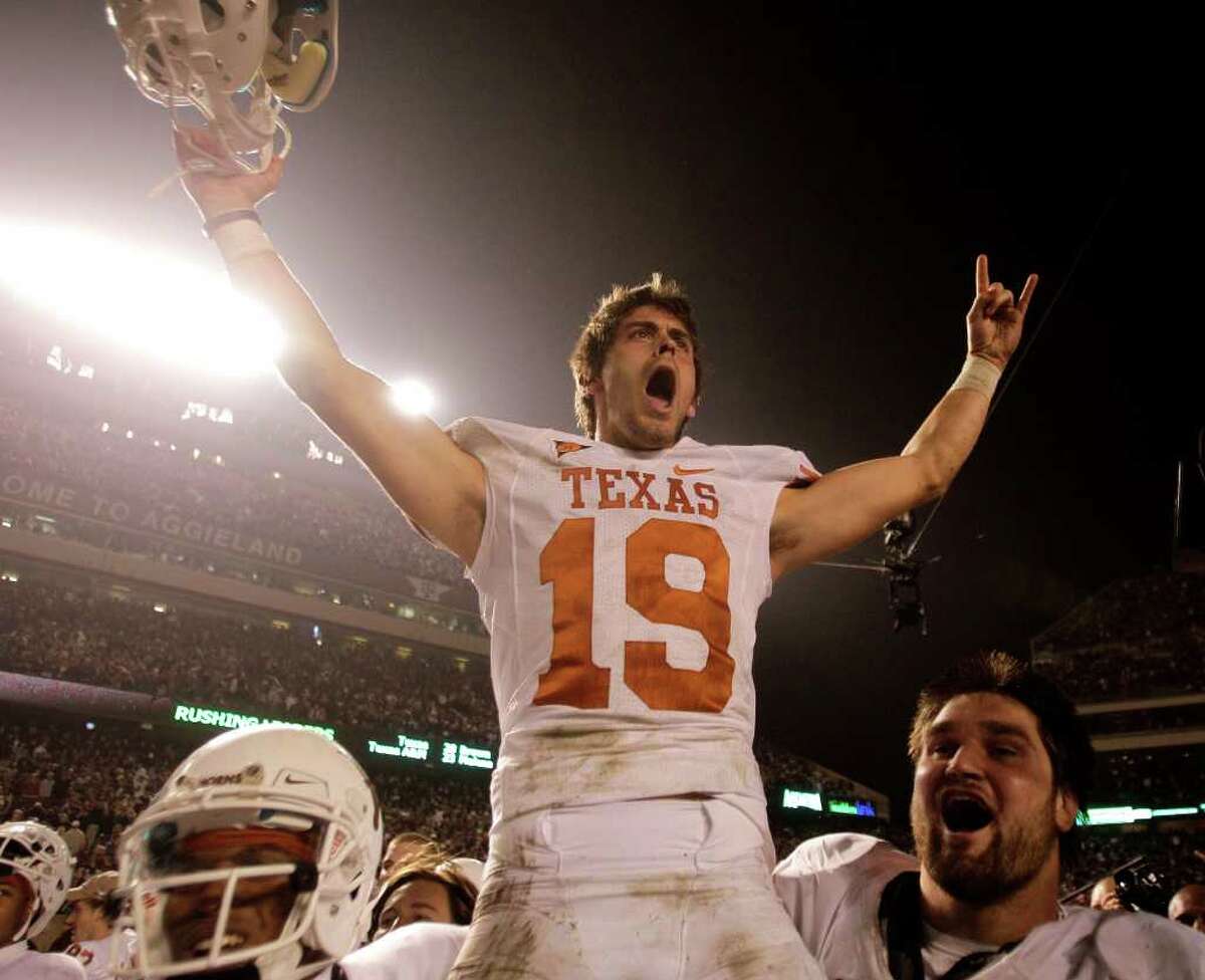 Texas kicker Justin Tucker (19) is carried off the field by his teammate after kicking a 40-yard field goal to beat Texas A&M during the fourth quarter of an NCAA college football game at Kyle Field Thursday, Nov. 24, 2011, in College Station. Texas beat Texas A&M 27-25.