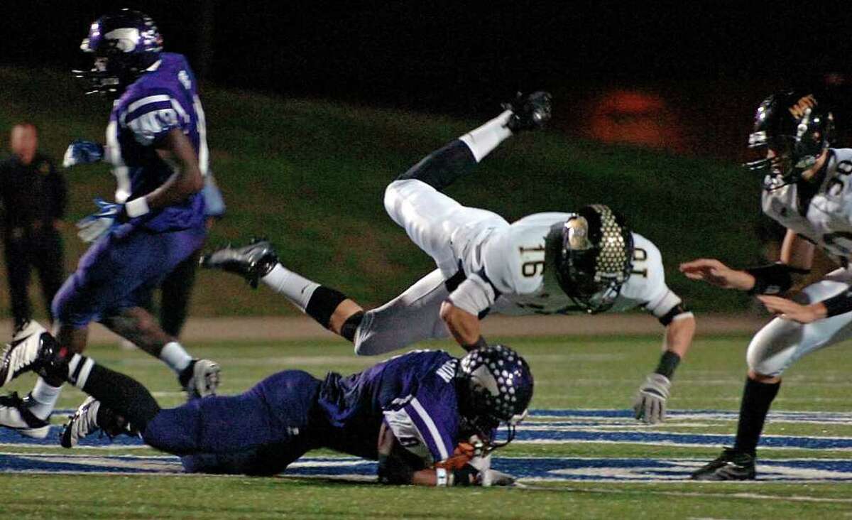 Vidor's Austin Powell assists in tackling a Wildcats runner at Galena Park Stadium Friday night. Photo taken Friday, November 25, 2011 Guiseppe Barranco/The Enterprise
