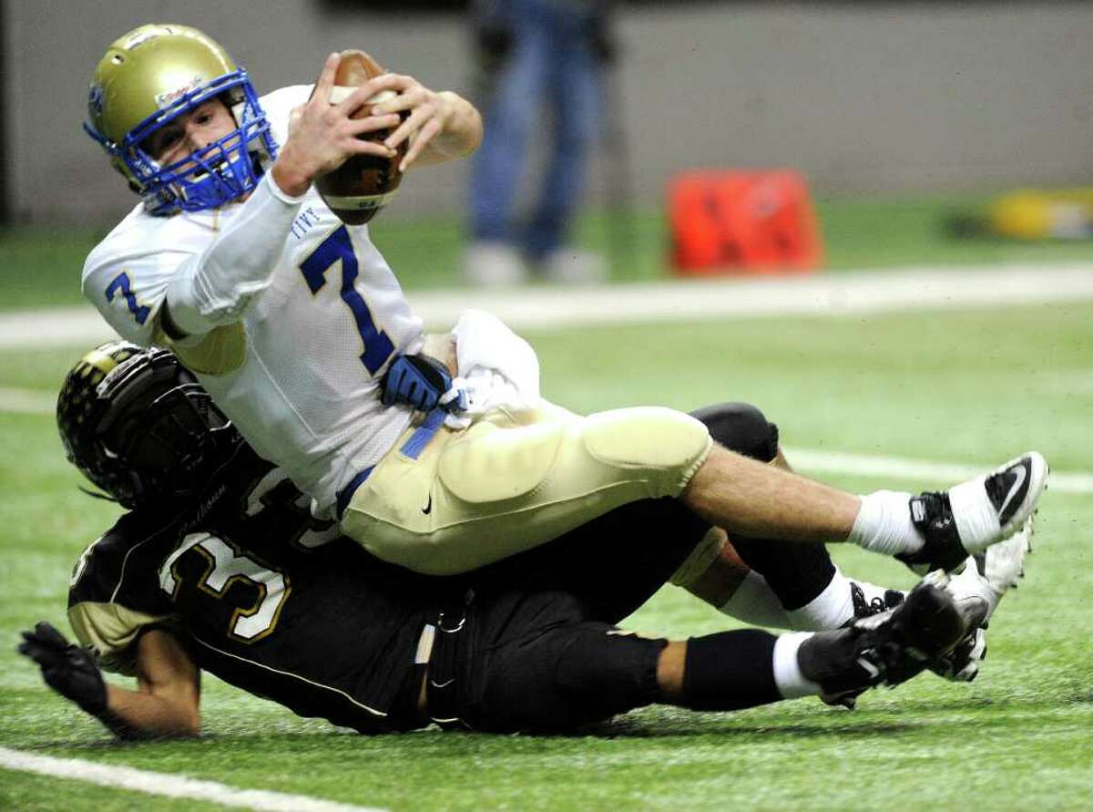 Kerrville Tivy quarterback Parks McNeil raches for the goal line for one of his four TDs against Port Lavaca Calhoun.