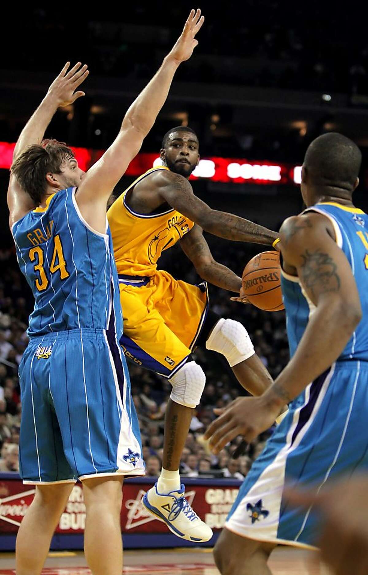 Dorrell Wright passes near the basket in the first half. The Golden State Warriors played the New Orleans Hornets at Oracle Arena in Oakland, Calif., on Tuesday, February 15, 2011. Ran on: 02-16-2011 Dorell Wright maneuvers to make a pass. Wright had 16 points and five assists.