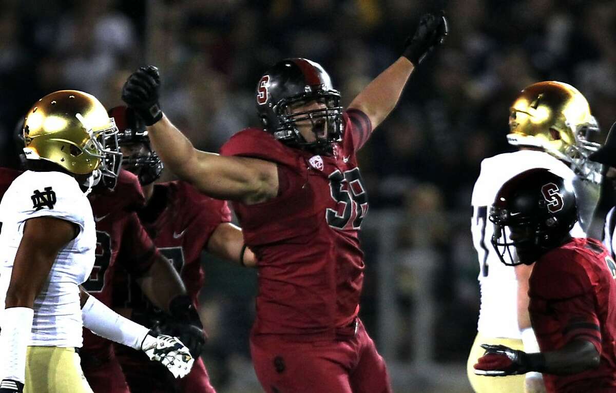 Stanford's Matt Masifilo celebrates his recovery of a Notre Dame fumble in the first quarter at Stanford Stadium on November 26 2011 in Stanford, California.