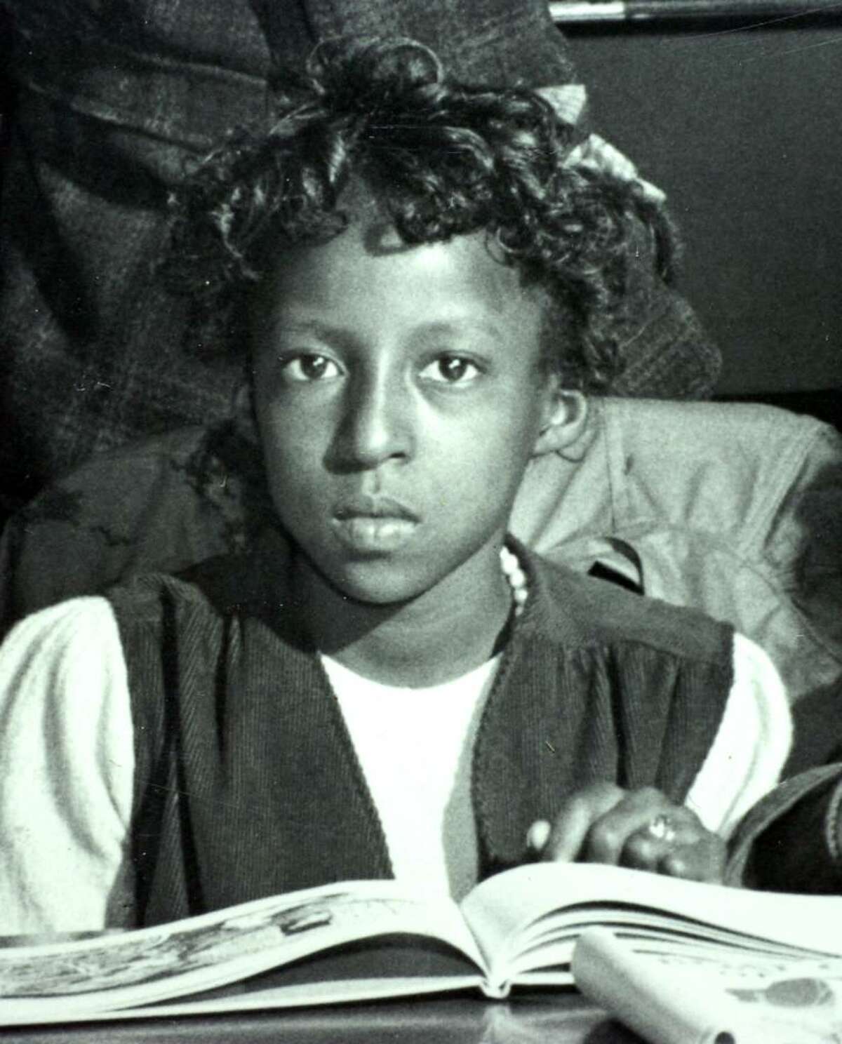 In a detail taken from a vintage photograph from 1944, belonging to the Historic Collections of the Bridgeport Public Library, Louise Dent, of Bridgeport, can be clearly recognized. At the time of this photo, Dent was an 11-year old school girl, taking part in a National Book Week event at the library.