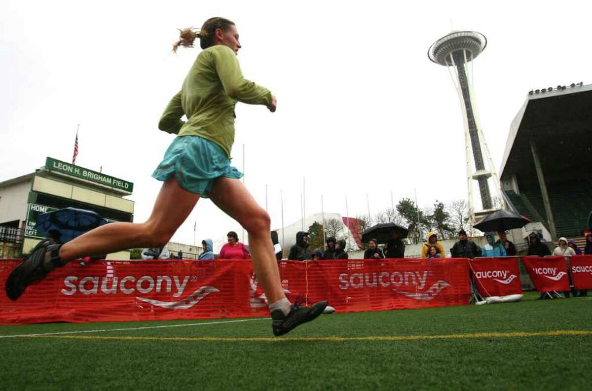 A runner heads for the finish line in Memorial Stadium during the Seattle Marathon on Sunday, November 27, 2011.