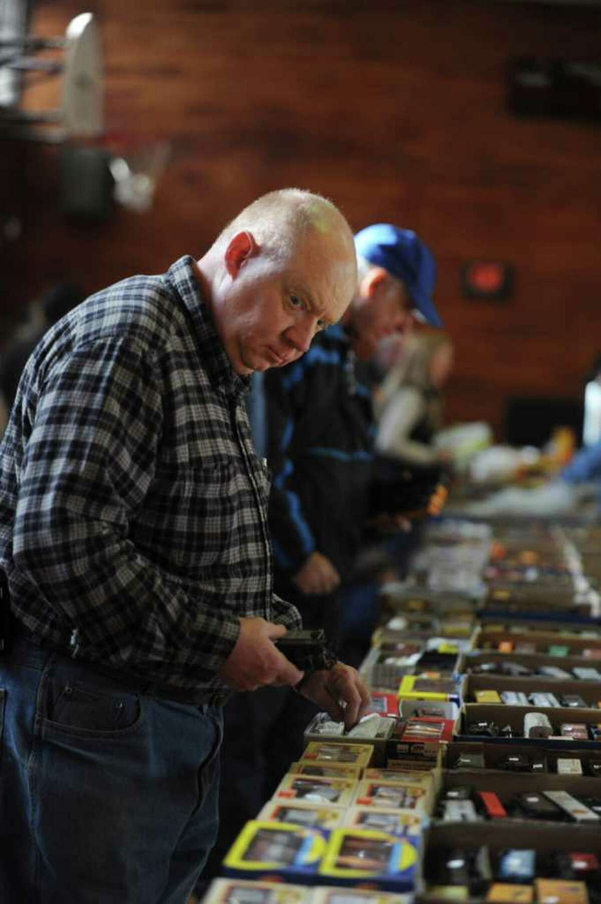 Ken Grogan, of Hartsdale, N.Y., looks at model trains at the Westchester Model Railroad Club's Fall Train Meet at Eastern Greenwich Civic Center Sunday, Nov. 27, 2011.