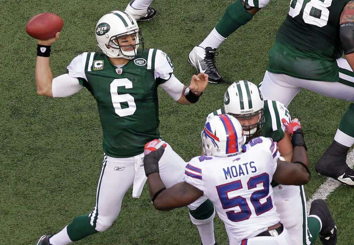 Ryan Fitzpatrick #14 of the New York Jets looks to pass against the Buffalo  Bills during the first quarter at MetLife Stad…