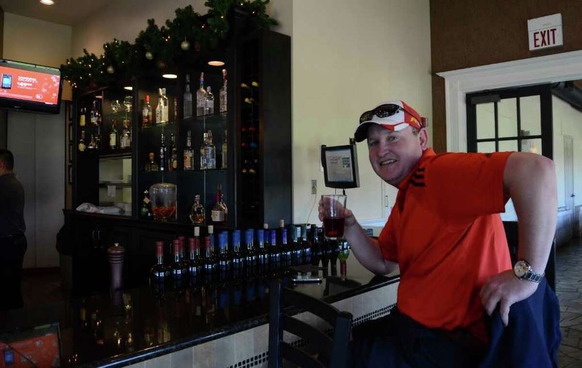 Will Lucas drips in for a drink between holes at the Quarry Golf Club on November 23, 2011. Robin Johnson