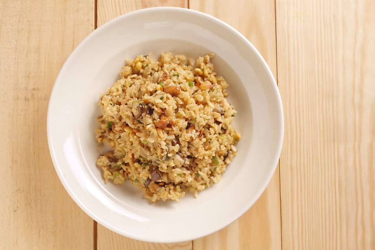 Brown rice with mushrooms and toasted pine nuts as seen in San Francisco, California, on November 9, 2011. Food styled by Amanda Gold.