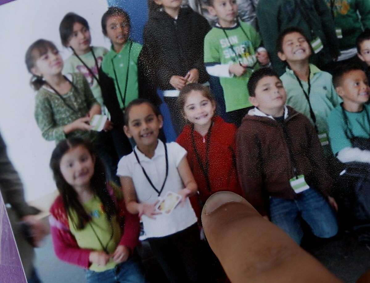 The young schoolchild victim known Sioreli is identified by a classmate in a school picture. She is the third from left, bottom row, in red. Two fatalities were reported in East Palo Alto Wednesday September 28, 2011. The first when an SUV being chased by police ran into a motorcyclist killing him, the second when a young schoolgirl was run over in a crosswalk only a few blocks away.