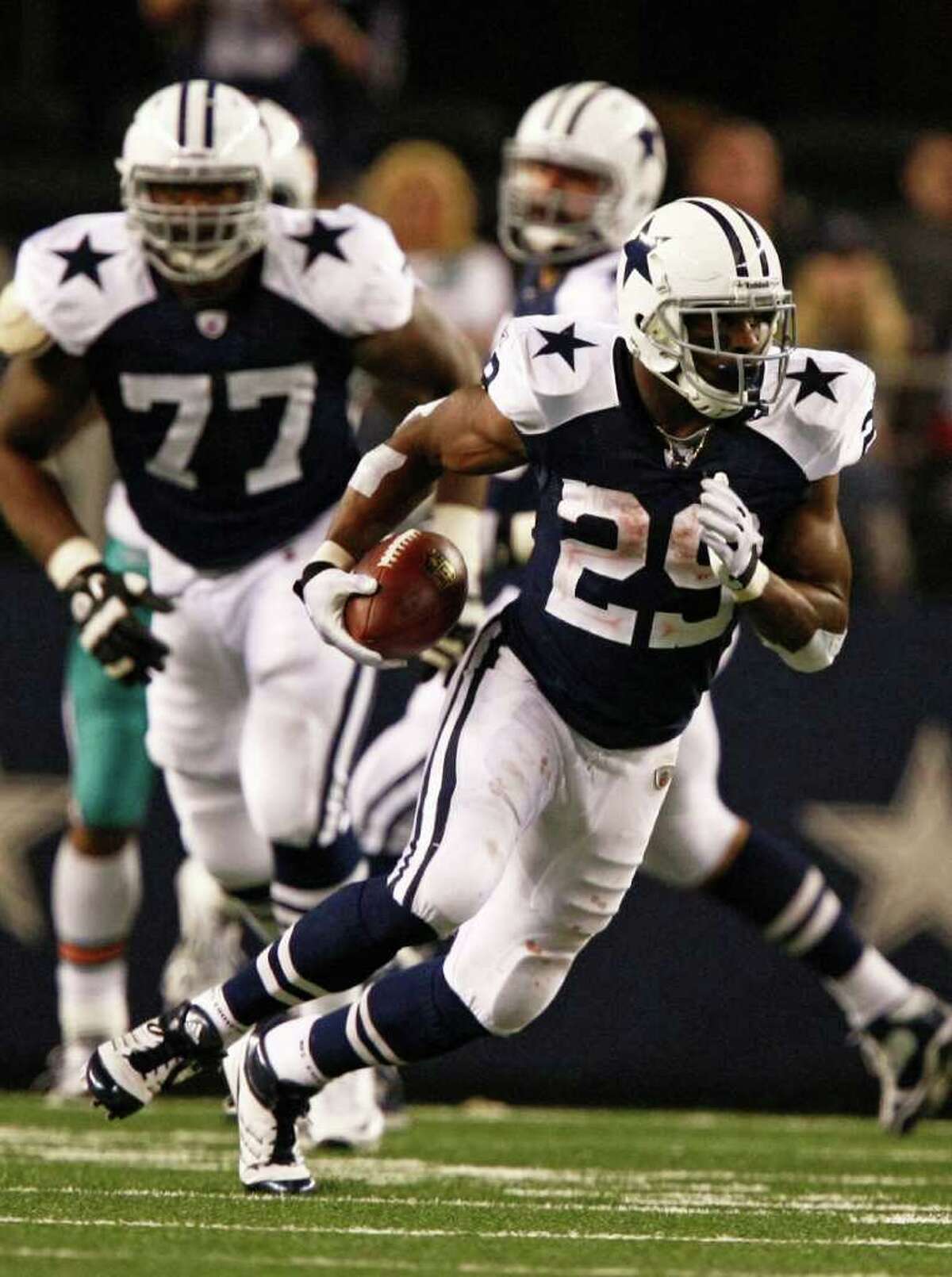 Dallas Cowboys running back DeMarco Murray (29) rushes for a first down during the second half of an NFL football game Thursday, Nov. 24, 2011, in Arlington, Texas.