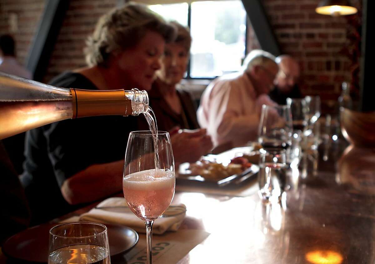 Sparkling wine is poured for customers at Cotogna Restaurant in San Francisco, Calif., on June 9th, 2011.