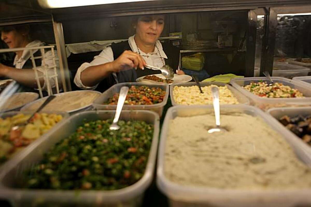 Hulya Besif prepares a appetizer platter at Eden's Mediterranean Turkish and Greek Restaurant, Monday August 23, 2010, in San Francisco, Calif.