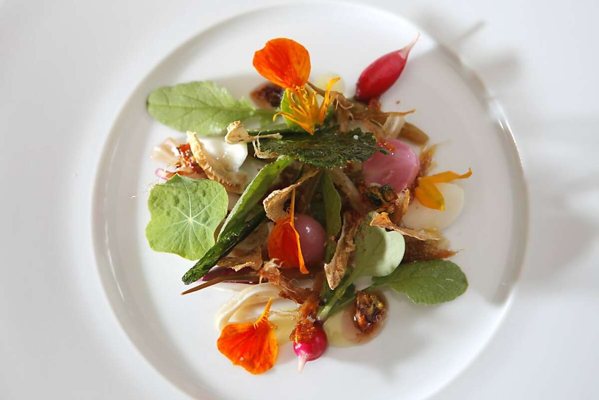 Garden radishes, pigs ear and nasturtium honey, is one of the dishes prepared at the newly remodeled Saison restaurant, Tuesday August 10, 2010, in San Francisco, Calif.