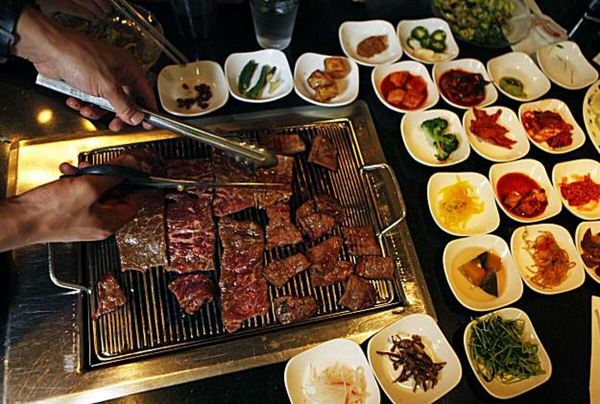 Ohgane Korean BBQ at 3915 Broadway in Oakland offers a verity of dishes that customers can grill themselves, like Place Broiled short ribs that come with side dishes of fermented vegetables and sauces. Friday July 30, 2010.