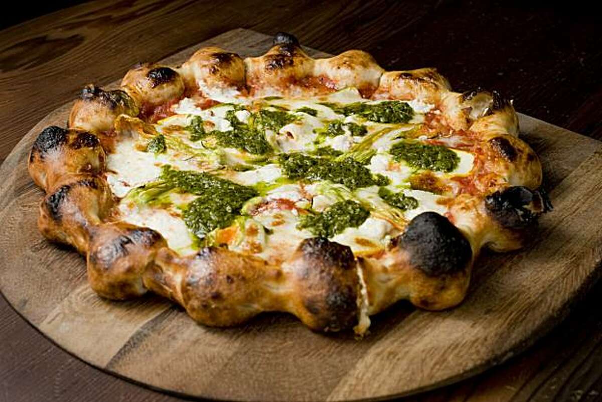 Pictured here is the "Heirloom Squashes" pizza which contains squash blossoms, Sierra Nevada goat cheese and arugula pesto and is seen in the bar area of the restaurant Gather in Berkeley, Calif., are photographed on Saturday, July 3, 2010.