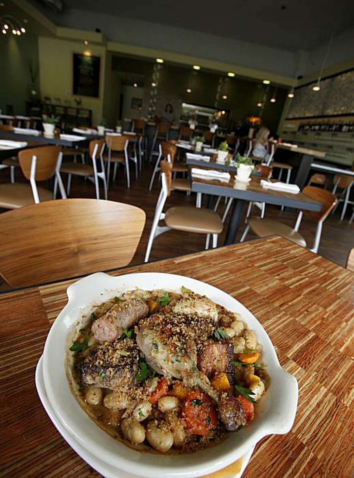 The cassoulet is a delicious French stew dish. Grace's Table in downtown Napa, Calif. is a popular eatery with a unique European style seating looking right out on Second Street.