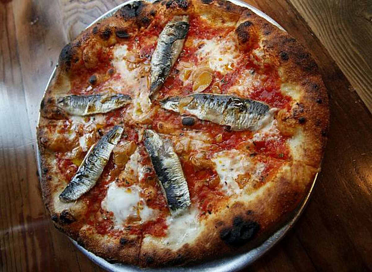 The Monterey Bay Sardine pizza is a favorite on the menu Wednesday May 26, 2010. Oenotri is a popular restaurant in downtown Napa, Calif. which features a large dining room with a view of the expansive kitchen.
