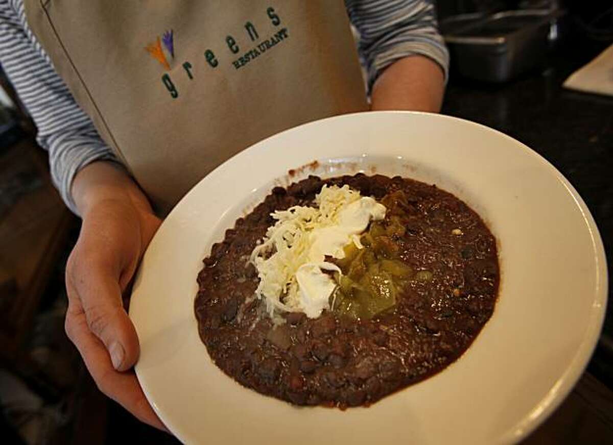 A healthy portion of black bean chili from the hot foods selection is garnished with creme fresh, and roasted chilis. Greens to Go, in the foyer of Greens restaurant at Fort Mason in San Francisco, Calif. has been refurbished and has a wide selection of vegetarian items to go.
