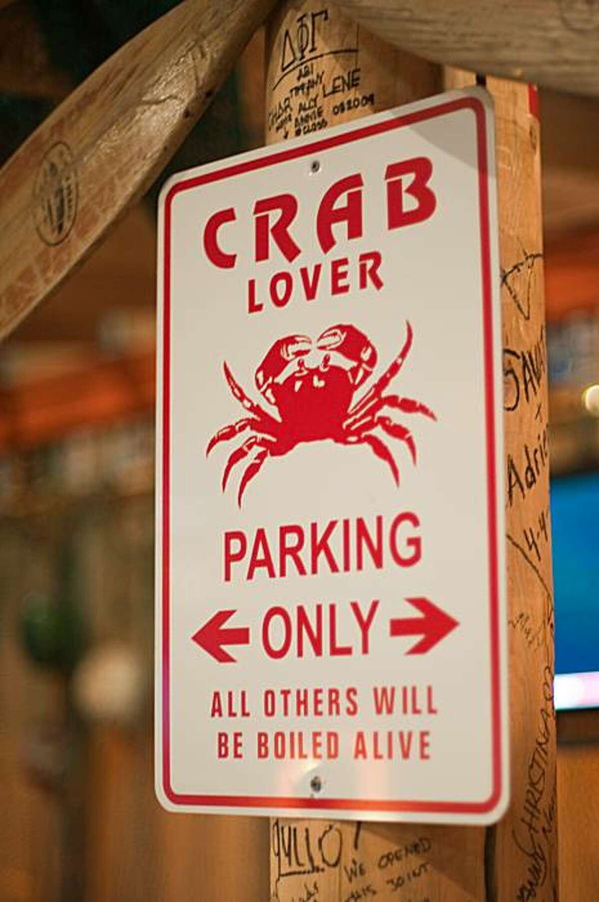 Details like this sign can be found throughout The Boiling Crab, adorning the walls and hanging from the ceiling.