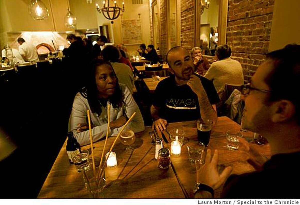 Karen Pape, Rob Pape and Nic Taylor (left to right) dine at Marzano, a cozy restaurant in Oakland, Calif., on Friday, January 16, 2008.
