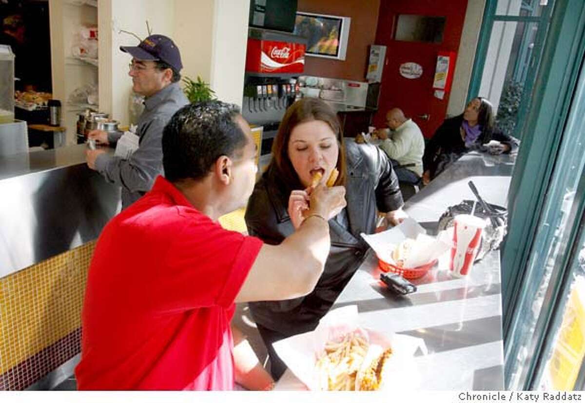 A french fry gets shared at Theo's Cheesesteak Shop, a small cheesesteak and fries joint on Spear St. in San Francisco, Calif. on Tuesday, Feb. 26, 2008. Photo by Katy Raddatz / The Chronicle