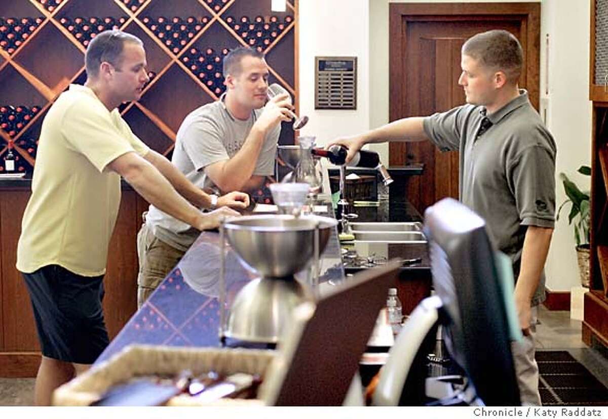 TASTINGROOM08_043_RAD.jpg SHOWN: At Geyser Peak Winery and tasting room Nick Miller pours a 2003 Malbec from the Alexander Valley to Keith Tully (C), and Glen Rich (L), both visiting from Denver. Photos shot on Thursday, Sept. 6, 2006, in Geyserville, CA. (Katy Raddatz/The S.F.Chronicle) **Geyser Peak, Nick Miller, Keith Tully, Glen Rich Mandatory credit for photographer and the San Francisco Chronicle/No sales-Mags out