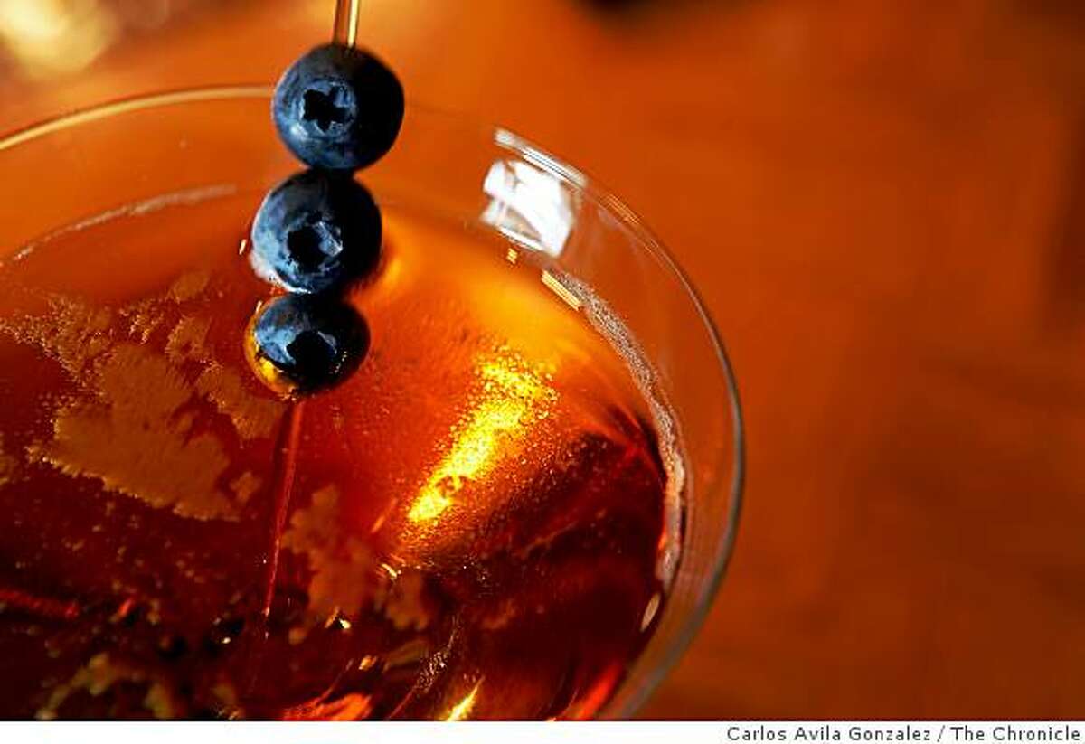 96 Hours Bar Bites feature the scene, people, food and drink at the Ritz bar in the Ritz-Carlton. The Dry Blueberry Manhattan cocktail served at The Ritz Bar.