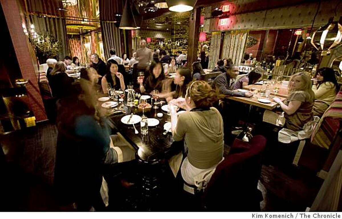 Patrons eat in the main dining room at Gitane Restaurant at 6 Caude Lane in San Francisco, Calif. Photographed on Saturday, Jan. 3, 2009.