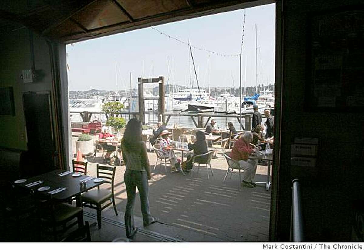 People have lunch outdoors at Le Garage, which is on the harbor in Sausalito, Calif. on Wednesday, September 10, 2008.