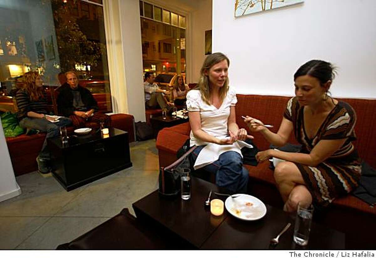 Echo Gaffney (left) and Nicole Brodsky (right), neighborhood patrons, share a vanilla brioche at Candy Bar located in San Francisco, Calif., on Thursday, July 17, 2008. Photo by Liz Hafalia/The Chronicle