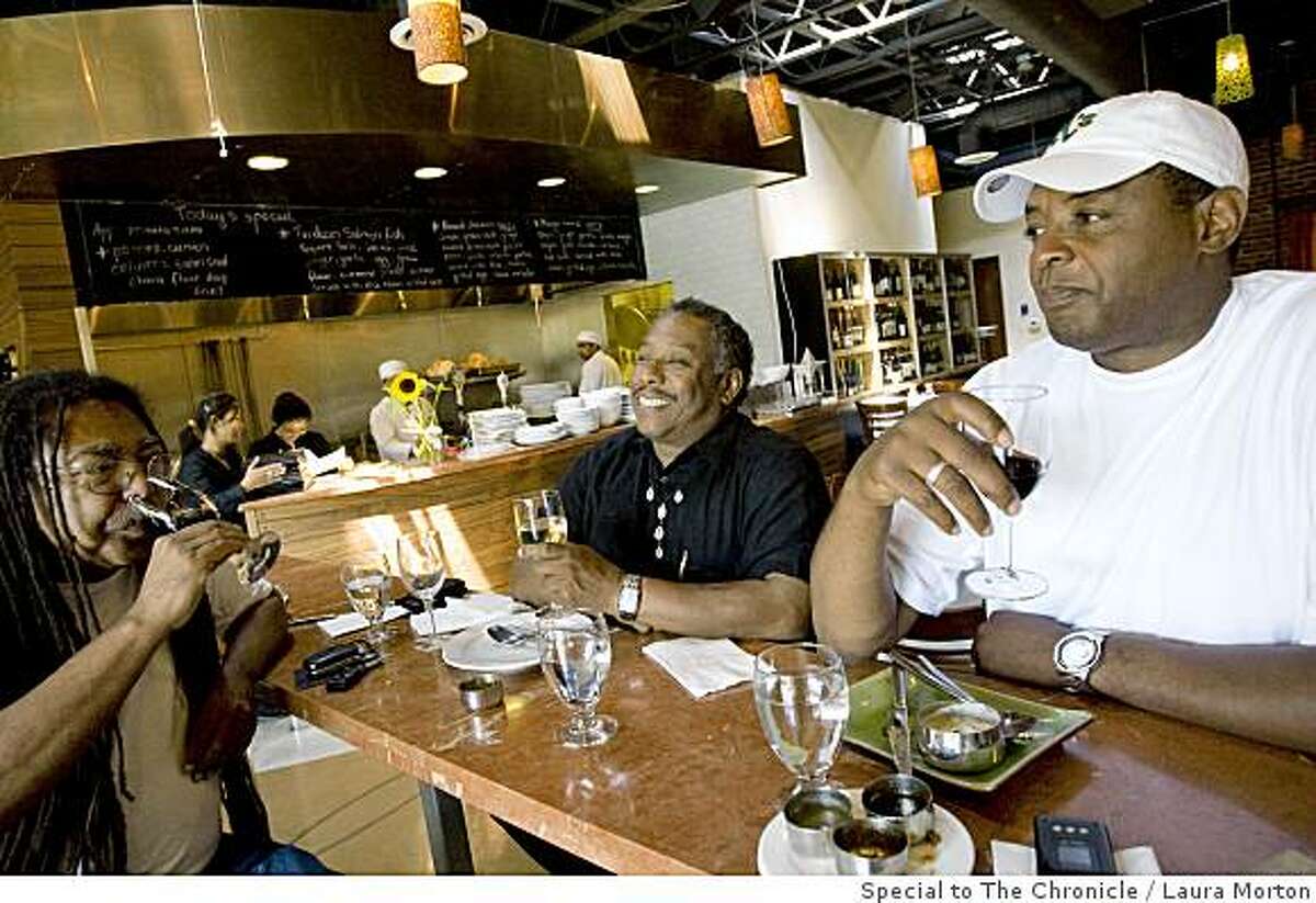 Fred Smith, Darinxoso Oyamasela and Gerald Thomas (left to right) enjoy a glass of wine at Mint Leaf, an Indian bistro and wine bar in Berkeley, Calif., on Saturday, June 14, 2008.