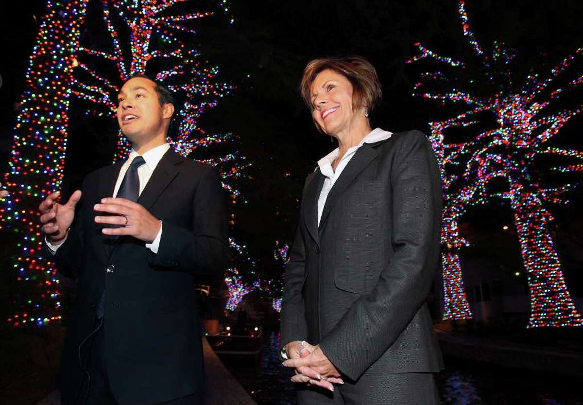 Barge riders Mayor Julián Castro and City Manager Sheryl Sculley seem impressed by the LED lights. Some pedestrians on the River Walk were not.