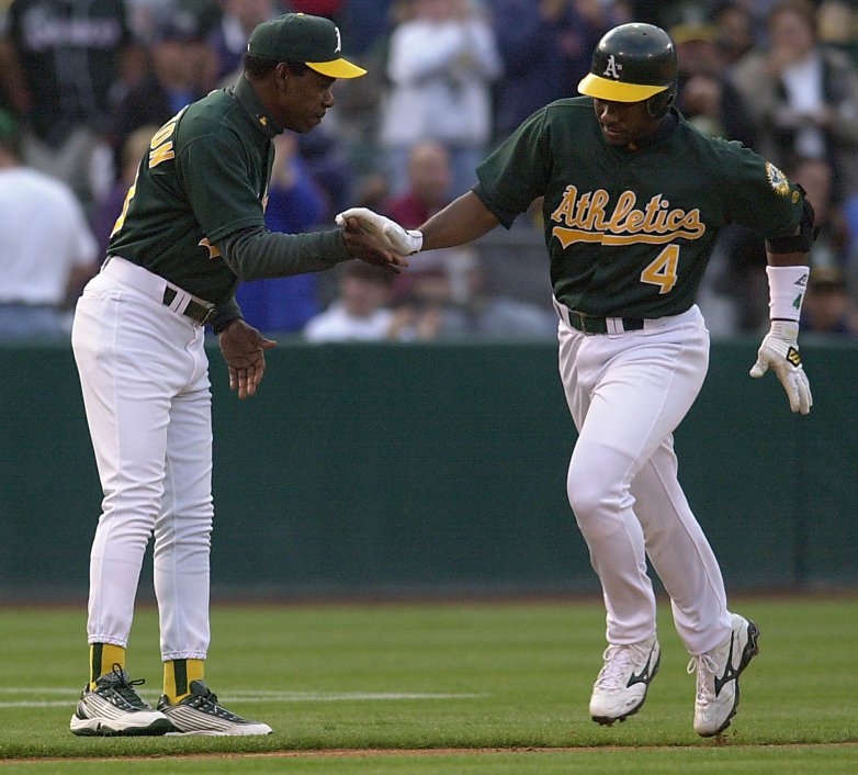 Erubiel Durazo of the Oakland Athletics greets Miguel Tejada after