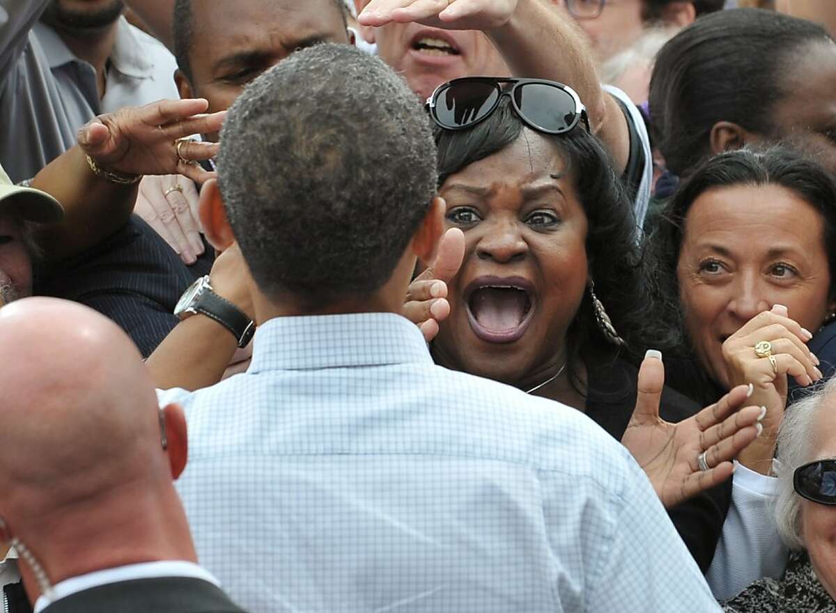 A woman screams as US President Barack Obama greets attendees after speaking at Labor Day celebrations on September 5, 2011 outside General Motor's world headquarters in Detroit. Obama is in Detroit to address the annual Labor Day event sponsored by the Metro Detroit Central Labor Council. AFP PHOTO/Mandel NGAN (Photo credit should read MANDEL NGAN/AFP/Getty Images) Ran on: 09-06-2011 President Obama gets a rousing welcome at a Labor Day rally outside the GM headquarters in Detroit. Obama will give a jobs speech to Congress this week.