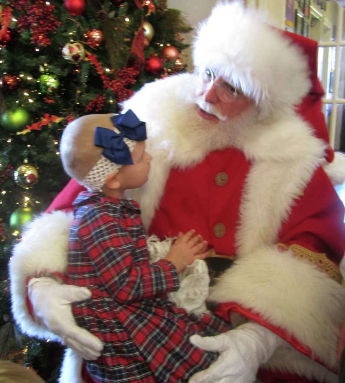 COURTESY: FIRETHORNE SPECIAL VISIT: Lucy Schuler, 3, visits with Santa.
