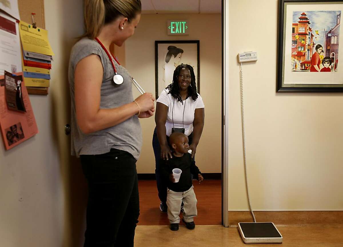 SF Empower volunteer Brittany Wilson greets diabetic Veronica Patterson and her grandson Anthony. A new program developed by two nurses from UCSF is helping people in San Francisco, Calif. with mental issues deal with diabetes. The program is administered at Glide Health Services.
