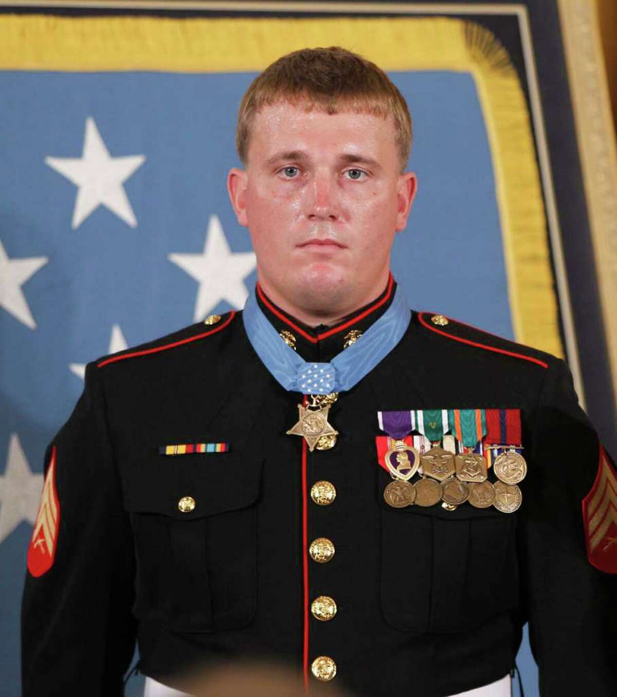 In this Sept. 15, 2010 file photo, Medal of Honor recipient, former U.S. Marine Sgt. Dakota Meyer, wears his medal after it was awarded to him by President Barack Obama, during a ceremony in the East Room of the White House in Washington.