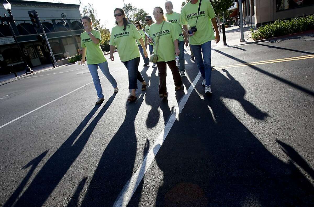 A group of local citizens wearing green "Fighting Back" t-shirts walked across Marin Street in effort to scare of prostitution and report crimes to the police. Citizen groups in Vallejo, Calif. have been credited with reducing street crime and prostitution on Sonoma Blvd. and Marin Street.