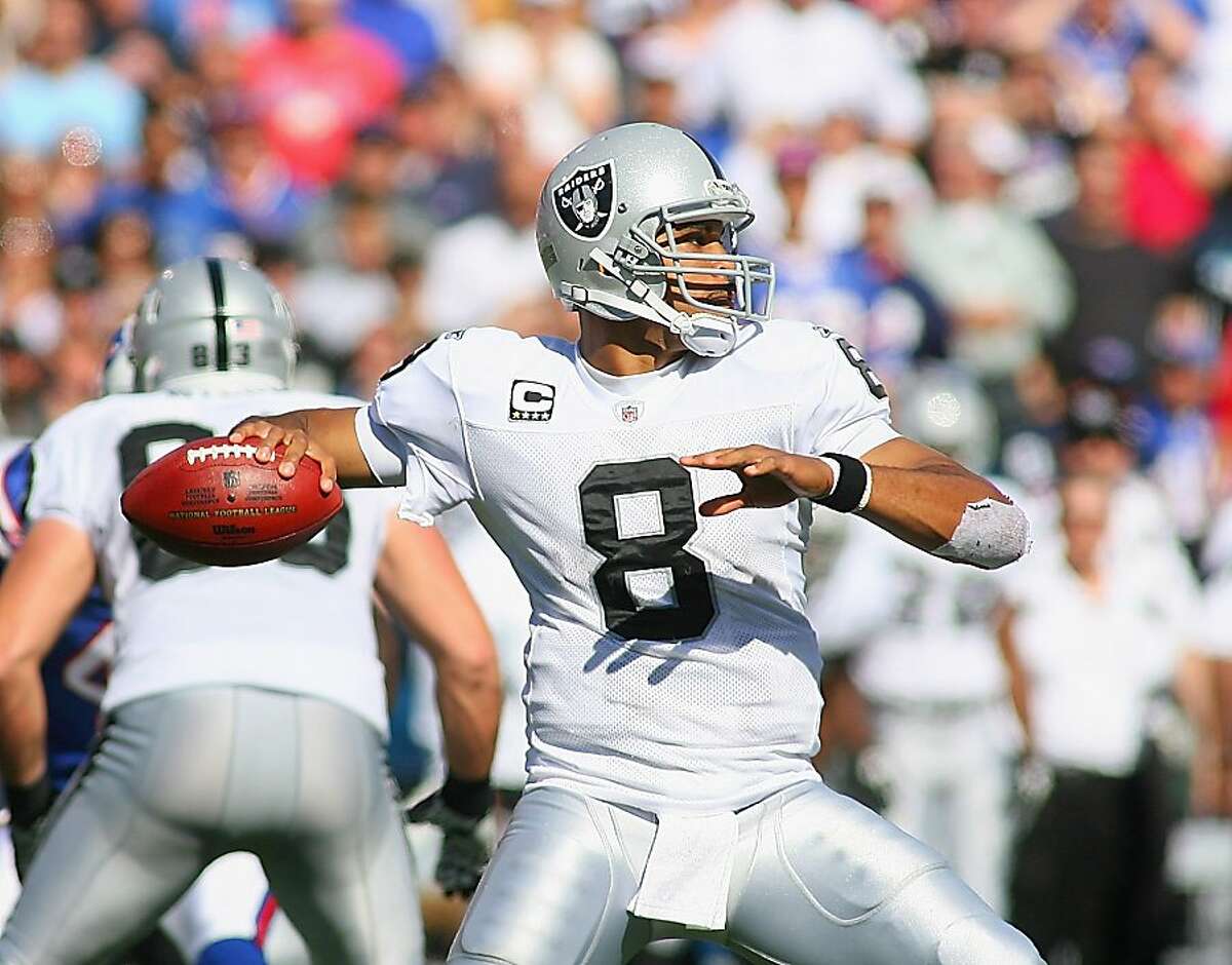 Oakland Raiders quarterback Jason Campbell (8) walks off the field