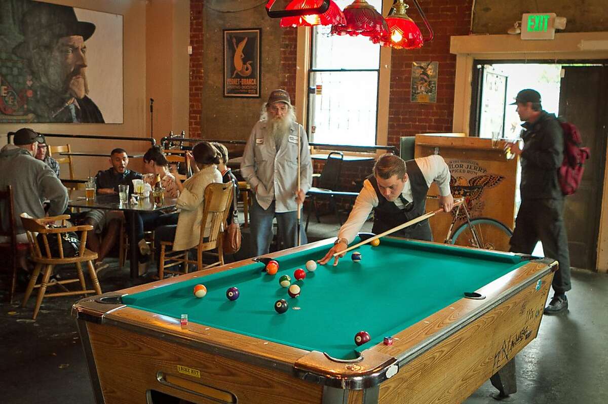 Customers play pool during happy hour at the Tempest in San Francisco, Calif., is seen on September 14th, 2011.