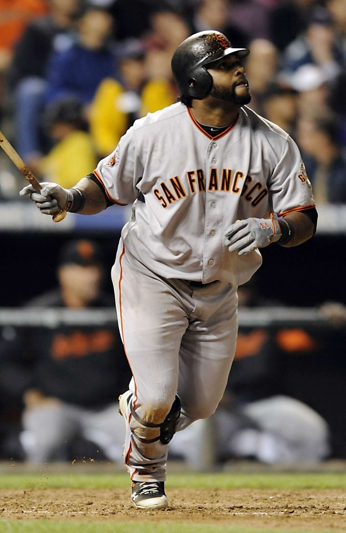 San Francisco Giants' Pablo Sandoval watches his triple off Colorado Rockies starting pitcher Jhoulys Chacin during the sixth inning of a baseball game Thursday, Sept. 15, 2011, in Denver. (AP Photo/Jack Dempsey)