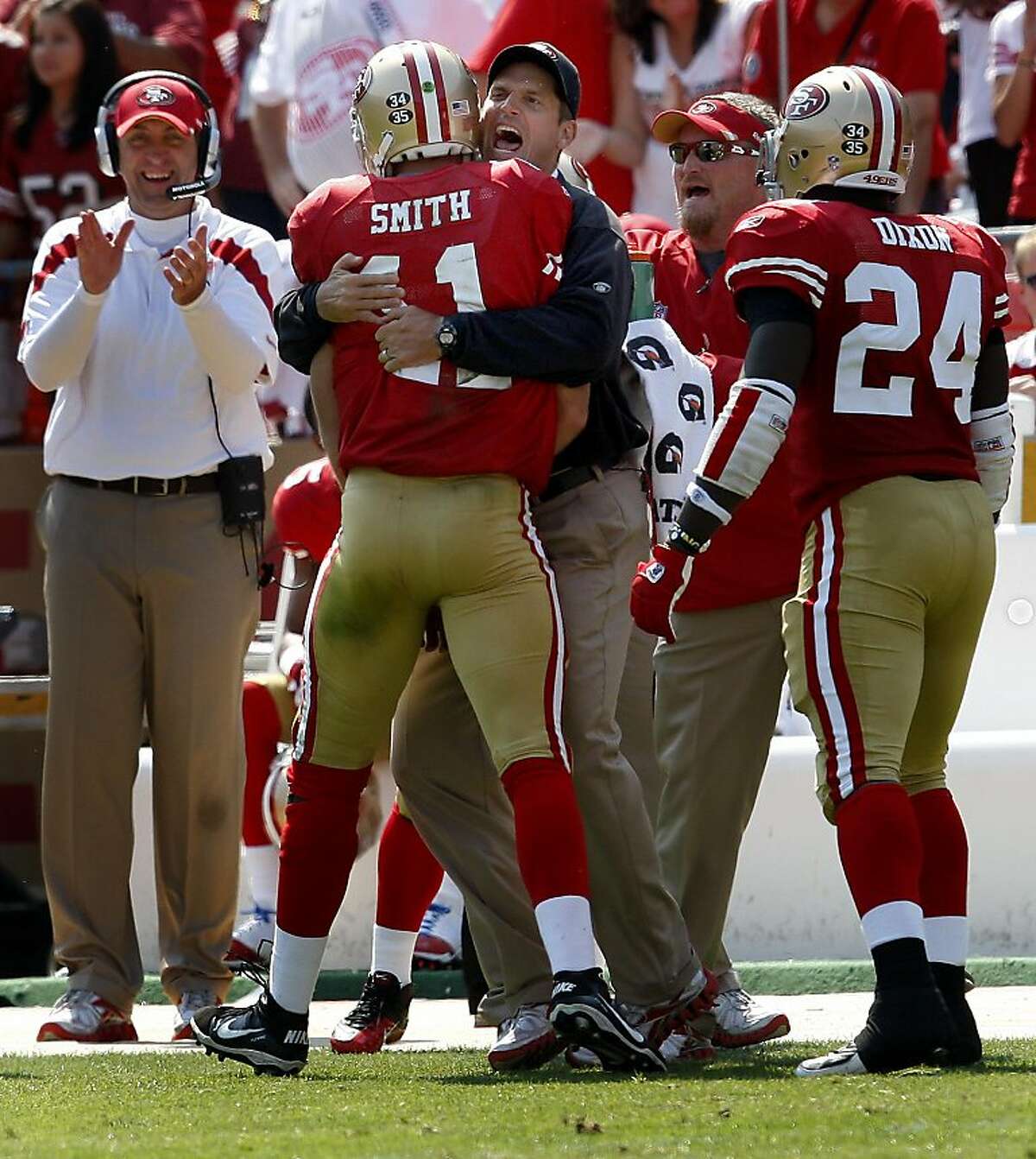 San Francisco 49er head coach Jim Harbaugh welcomed Alex Smith back to the sideline after his 2nd quarter touchdown. San Francisco 49ers in action against the Seattle Seahawks Sunday September 11, 2011 at Candlestick Park.