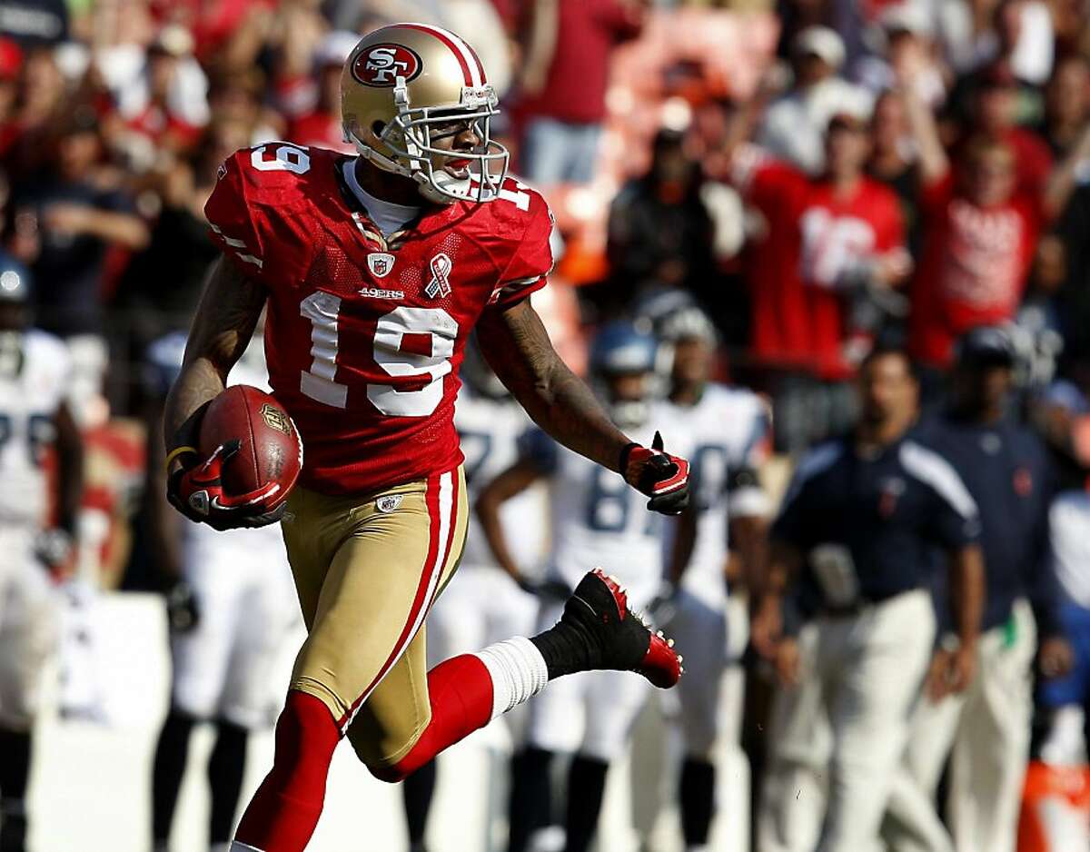 Ted Ginn Jr. looks back at the defense after scoring his first runback touchdown. The San Francisco 49ers defeat the Seattle Seahawks 33-17 at Candlestick Park Sunday September 11, 2011.