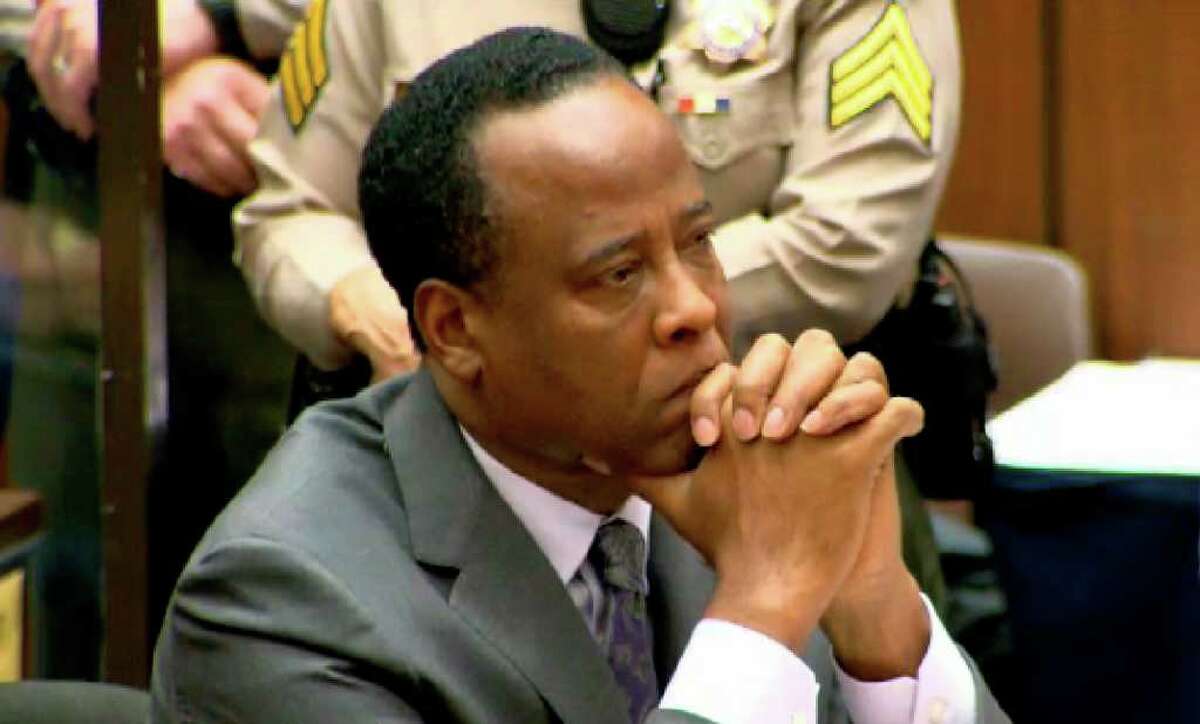 In this frame grab made from pool video, Dr. Conrad Murray listens as Judge Michael Pastor sentences him to the maximum four years in county jail for his involuntary manslaughter conviction of pop star Michael Jackson, Tuesday, Nov. 29, 2011 on Superior Court in Los Angeles.