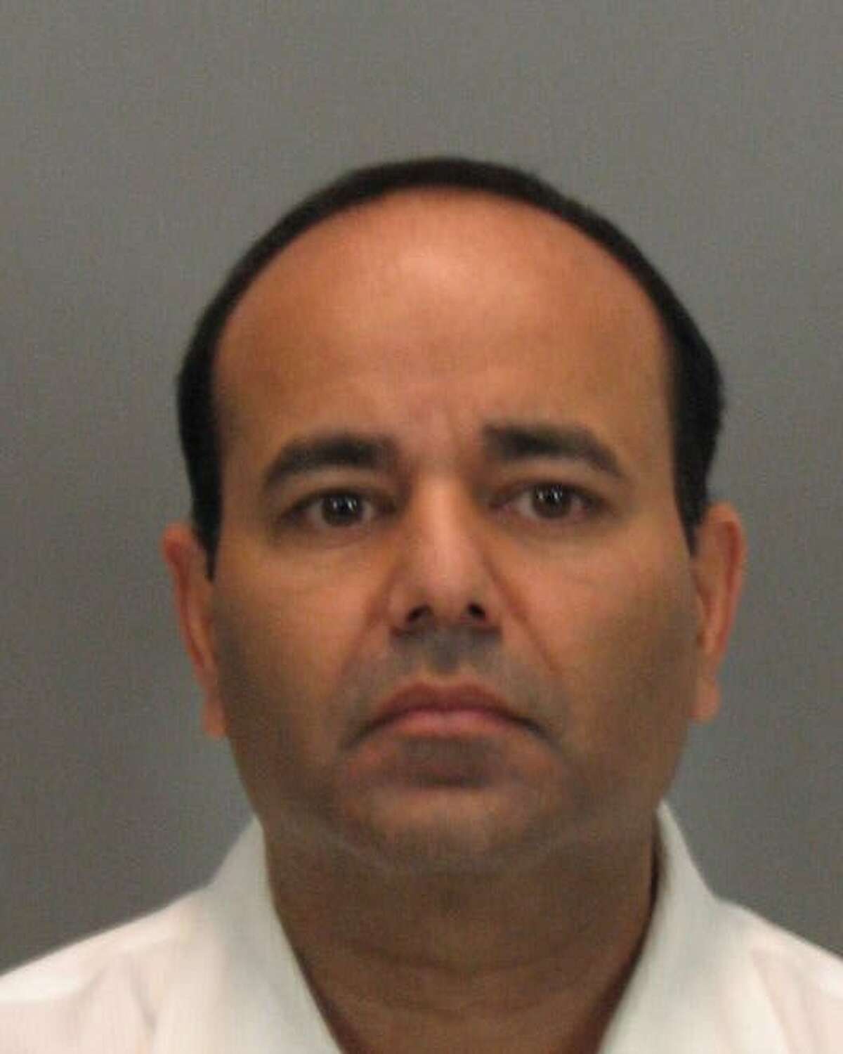 Ausaf Umar Siddiqui appears in this undated booking photo provided by the Santa Clara County (Calif.) Sheriff's Office. Siddiqui, a former vice president of Fry's Electronics Inc., has been arrested on charges of embezzling more than $65 million from the retailer to fuel his lavish lifestyle and pay off debts. (AP Photo/Santa Clara County Sheriff via the San Jose Mercury News) Ran on: 12-24-2008 Ausaf Umar Siddiqui worked at Frys Electronics for 20 years. Ran on: 12-24-2008 Ausaf Umar Siddiqui worked at Frys Electronics for 20 years. Ran on: 12-25-2008 Ausaf Umar Siddiqui is accused of embezzling money from Frys through a $65 million kickback scam. Ran on: 12-25-2008 Ausaf Umar Siddiqui is accused of embezzling money from Frys through a $65 million kickback scam. Ran on: 12-27-2008 Ausaf Umar Siddiqui is a former vice president of Frys accused of embezzling more than $65 million.