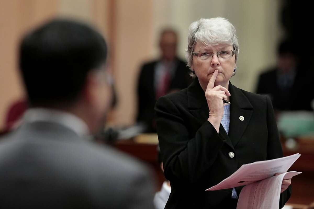 State Sen. Christine Kehoe, D-San Diego, listens as State Sen. Ted Lieu, D-Torranced urged lawmakers to reject a measure she is carrying to ban the sale, trade or possession of shark fins, during the Senate session at the Capitol in Sacramento, Calif., Tuesday, Sept. 6, 2011. Lieu and Sen. Leland Yee, D-San Francisco, called the bill, by Assemblyman Paul Fong, D-Cupertino, a racist measure because the fins are used in a soup considered a delicacy in some Asian cultures. Despite the opposition the bill was approved on a 25-9 vote and sent to the governor. (AP Photo/Rich Pedroncelli)
